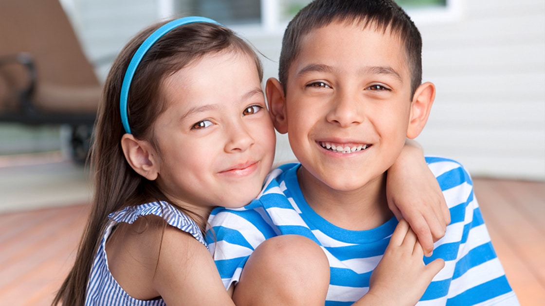 Brother sister smiling photo